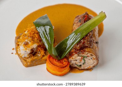 Chef plating technique, The main component is rolled chicken meat, often filled with vegetables or farce and served with a rich sauce.