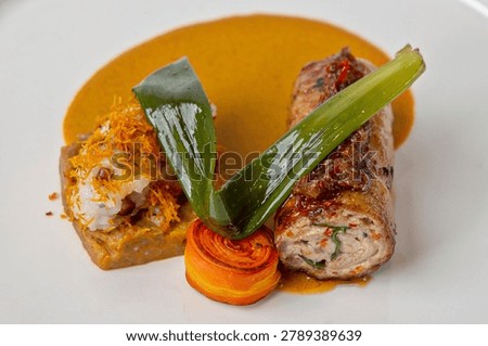 Chef plating technique, The main component is rolled chicken meat, often filled with vegetables or farce and served with a rich sauce.