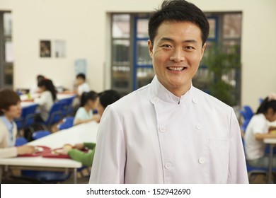 Chef Portrait In School Cafeteria