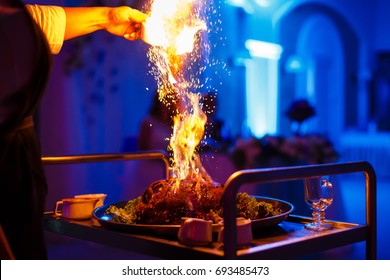 Chef, Pouring Alcohol Into A Frying Pan With Fire