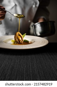 Chef Pouring Sauce On Abalone