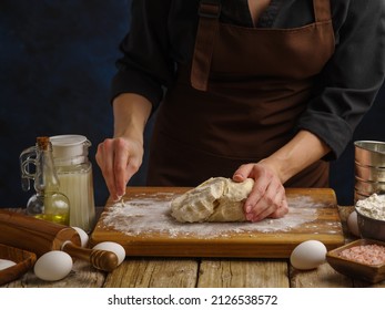 The Chef Prepares The Dough On A Wooden Table. Ingredients For Making Pizza, Bread, Pie, Pasta, Confectionery. Restaurant, Hotel, Pizzeria, Patisserie, Home Cooking.