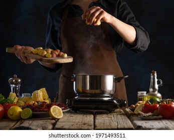 The Chef Prepares Potatoes, Corn And Crayfish. Foods Background Culinary Recipes And Cooking Recipes