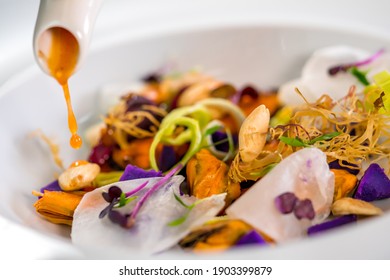 The chef prepares the special Gourmet dishes. Elegant Italian Food gourmet, white plate for lunch and dinner. Meal fine dining closeup.