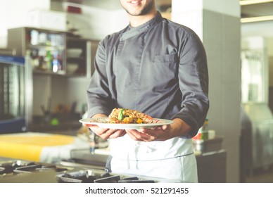 Chef preparing delicious meal - Powered by Shutterstock