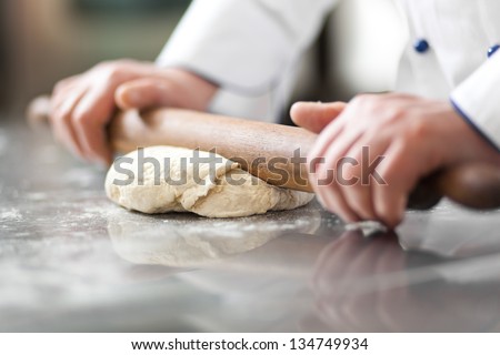 Similar – Image, Stock Photo Close-up of hands kneading pizza dough on kitchen counter