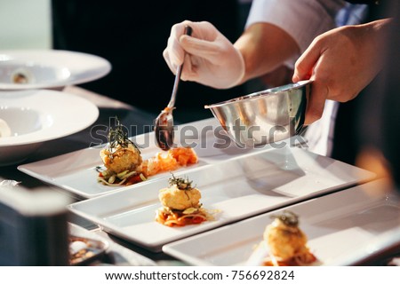 Chef preparing food, meal, in the kitchen, chef cooking in kitchen, Chef decorating dish, closeup