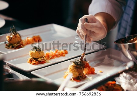 Chef preparing food, meal, in the kitchen, chef cooking in kitchen, Chef decorating dish, closeup