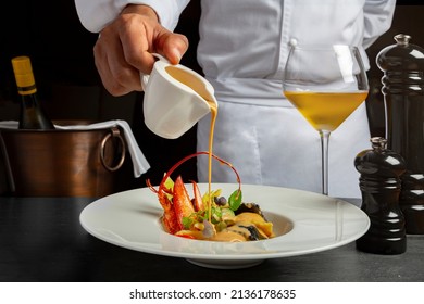 Chef preparing the food with sauce - Powered by Shutterstock