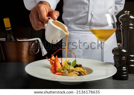 Chef preparing the food with sauce