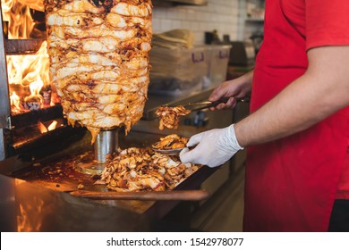 Chef Preparing And Making Traditional Turkish Doner Kebab Meat. Shawarma Or Gyros. Turkish, Greek Or Middle Eastern Arab Style Chicken Doner Kebab Food On Isolated White.