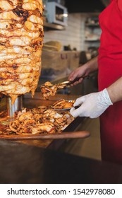 Chef Preparing And Making Traditional Turkish Doner Kebab Meat. Shawarma Or Gyros. Turkish, Greek Or Middle Eastern Arab Style Chicken Doner Kebab Food On Isolated White.