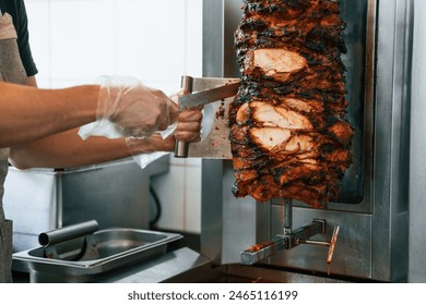 Chef preparing and making traditional Turkish Doner Kebab meat. Shawarma or gyros. - Powered by Shutterstock