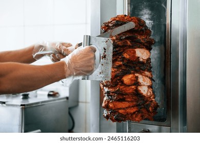 Chef preparing and making traditional Turkish Doner Kebab meat. Shawarma or gyros. - Powered by Shutterstock