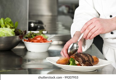 Chef Preparing Meal (steak With Croquette)