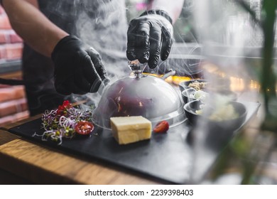 Chef preparing modern take on beef tartar. Traditional Polish cuisine mixed with molecular gastronomy. Indoor shot. High quality photo - Powered by Shutterstock