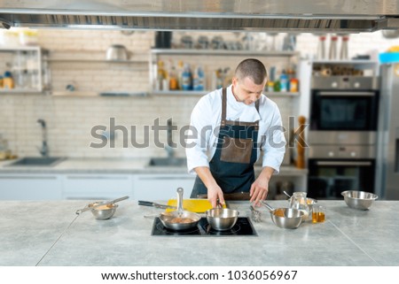 chef preparing a polenta in the restaurant kitchen. cooking process