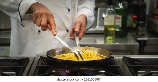 chef preparing spaghetti