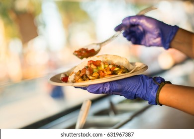 Chef Preparing Tacos In A Food Truck.