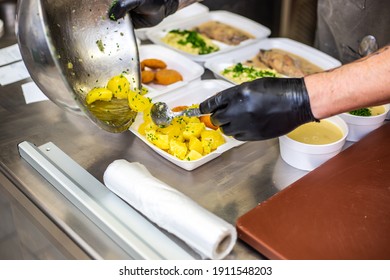 Chef preparing takeaway dish in the restaurant or pub , food delivery concept, home delivery, online order - Powered by Shutterstock