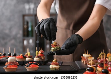 Chef Preparing Tasty Canapes For Serving