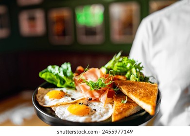 Chef presenting a gourmet breakfast with sunny side up eggs, smoked salmon, fresh greens, and toast. A colorful and appetizing culinary art. - Powered by Shutterstock