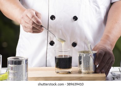 Chef Putting Condensed Milk In To Hot Coffee