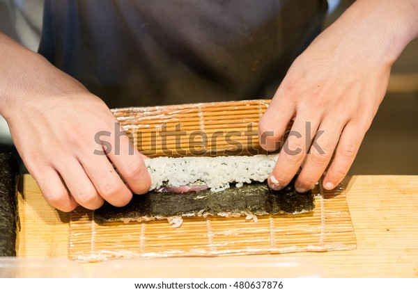 Chef Rolling Sushi On Bamboo Mat Stock Photo Edit Now 480637876