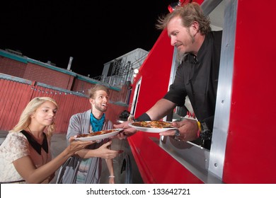 Chef Serving Carryout Pizza From Food Truck