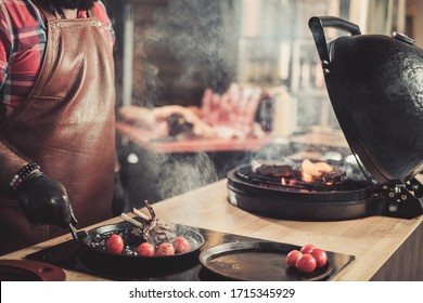 Chef serving freshly cooked ribs in a restaurant - Shutterstock ID 1715345929