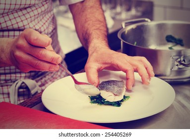 Chef Is Serving Steamed Seabass With Spinach, Toned Image