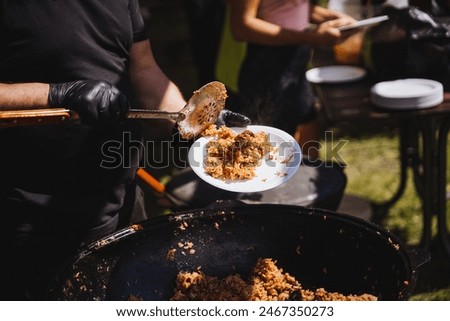 Authentic Spanish paella served with bread and wine