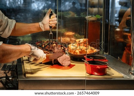 Chef Slicing Roast Beef at Buffet Station