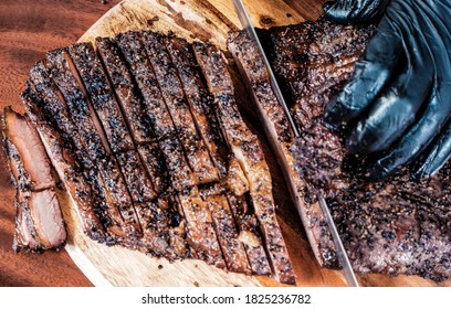 Chef Slicing A Smoked Beef Brisket 
