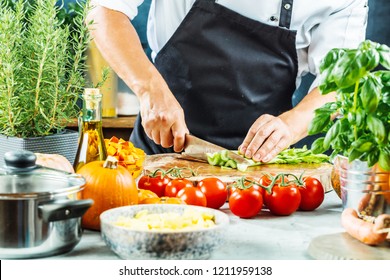 The chef slicing vegetables. - Powered by Shutterstock