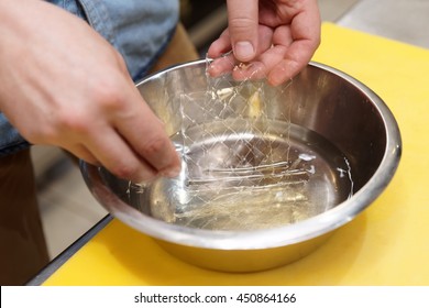 Chef Is Soaking Gelatin Sheets In Cold Water