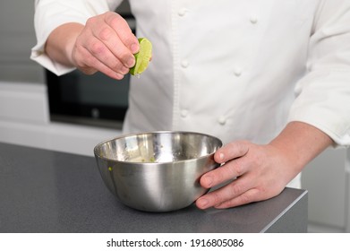 Chef sprinkles lime juice. Adding spices for taste. Food concept. High quality photo