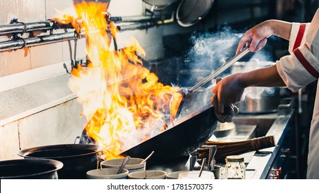 Chef Stir Fry Cooking In Kitchen, Professional Chef Fire Cooking Of Restaurant, Street Food Cooking Style