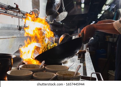 Chef Stir Fry Cooking Vegetable In Wok