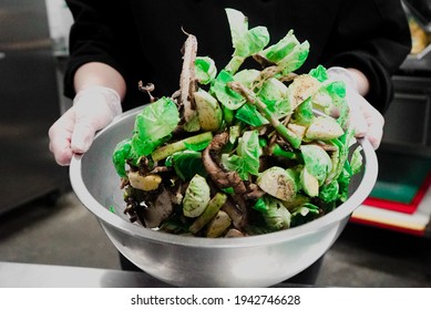 Chef Tossing Brussel Sprouts In Bowl