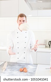 Chef Tossing Pizza Dough