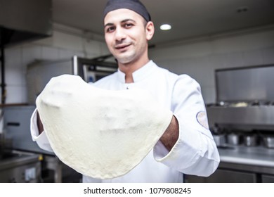 Chef  Tossing Pizza Dough