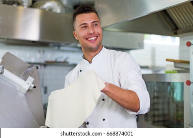 Chef Tossing Pizza Dough
