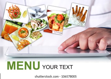 Chef is using a digital tablet, With a pictures Food items