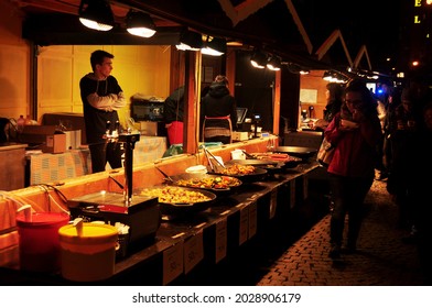 Chef Vendor Cooking Local Street Food Czech Style At Hawker Shop For Sale Czechia People And Foreign Travelers Customer Eat Drink At Old Town Praha City On December 11, 2016 In Prague, Czech Republic