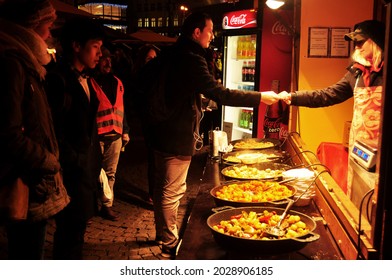 Chef Vendor Cooking Local Street Food Czech Style At Hawker Shop For Sale Czechia People And Foreign Travelers Customer Eat Drink At Old Town Praha City On December 11, 2016 In Prague, Czech Republic