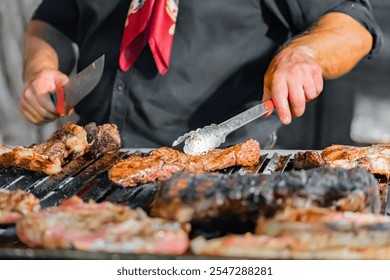 Chef wearing red bandana, grilling steaks over open flame on barbecue, carefully cooking meat to perfection - Powered by Shutterstock