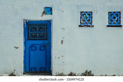 Chefchaouen, Morocco, February 23, 2018 Street view in Africa, in Chefchaouen, Morocco. Traditional buildings, narrow streets and colorful houses in blue and white - Shutterstock ID 1504974125