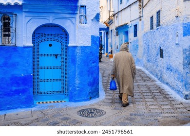 Chefchaouen, Morocco. The old walled city, or medina with its traditional houses painted in blue and white. - Powered by Shutterstock