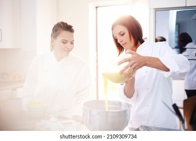 Chefs Baking Pouring Batter In Bowl